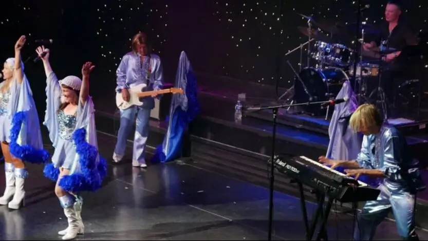 Marbella piano lessons owner, Jens-Ebert Nordbjerg performing with Abbamax aboard RCL Symphony Of The Seas.